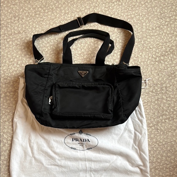 Prada Black Baby Bag with Adjustable Shoulder Strap and Structured Design - Picture 1 of 5